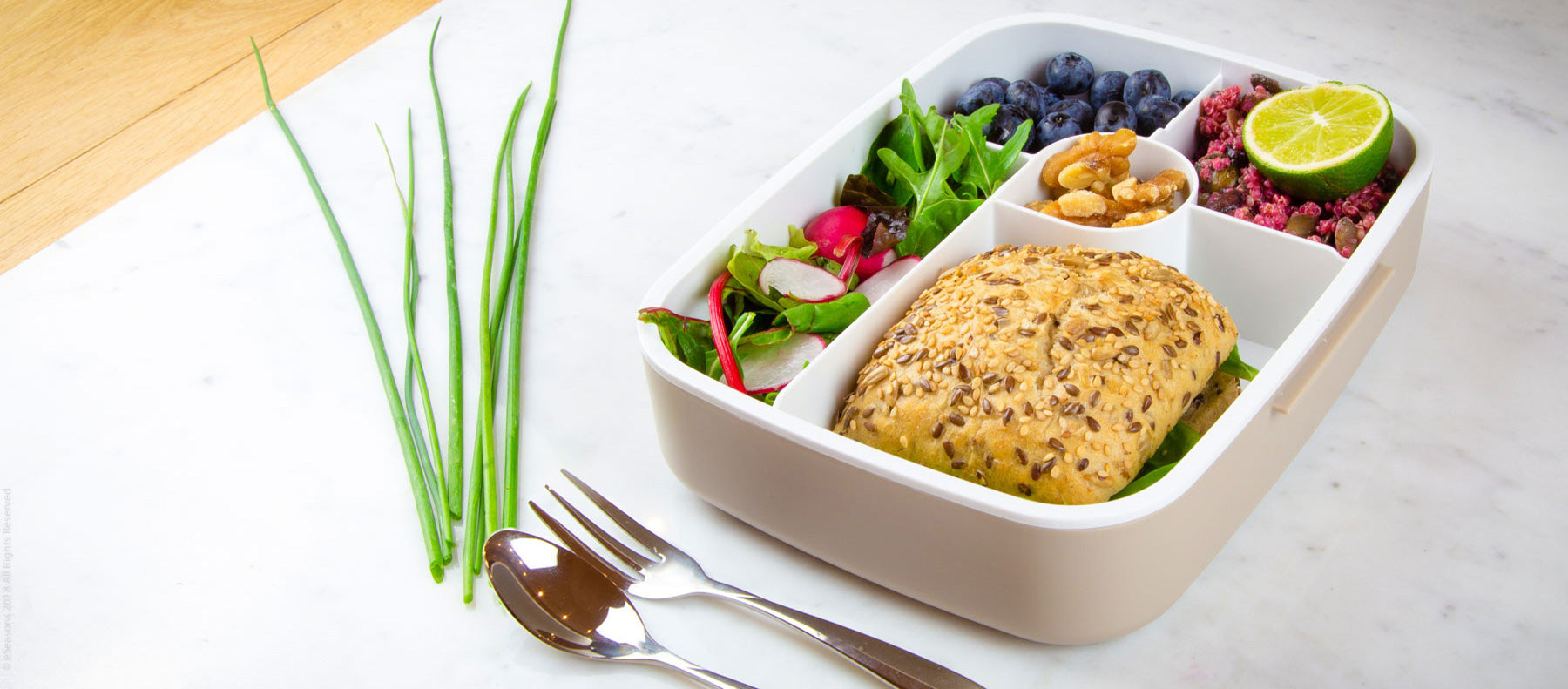 Gorgeous food photography: eSeasons Bento 5 compartment Lunchbox in Warm Grey with appetizing lunch of salad, blueberries, and sandwich