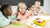 eSeasons Bento 5 compartment Lunchbox in Green: Childrens’ school mealtime, with lunch including fruits, carrots, and a sandwich