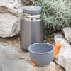 eSeasons Vacuum Insulated Stainless Steel Food Flask 630ml. Grey & Orange. Keeps hot/cold, expanded view stone backdrop from hiking trip